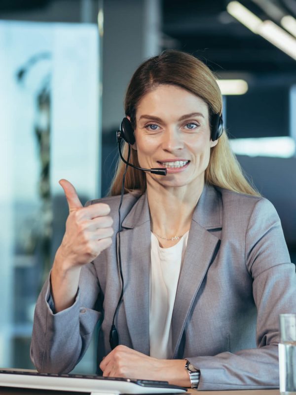 portrait-of-woman-with-headset-call-center-employee-smiling-and-happy-talking.jpg
